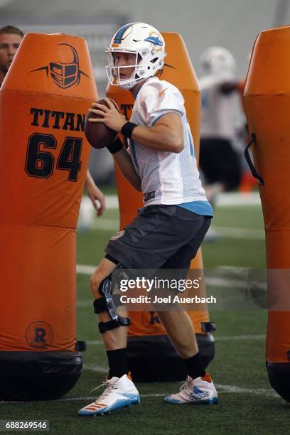 Ryan Tannehill of the Miami Dolphins runs a drill during the teams OTA's on May 25, 2017 at the Miami Dolphins training facility in Davie, Florida.