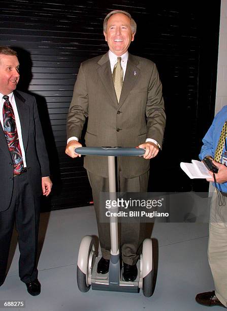 Delphi Automotive Systems'' Chairman, President and CEO J.T. Battenberg III enjoys test driving the new Segway HT Personal Transporter December 18,...
