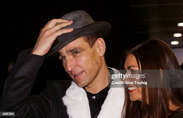 Actor and former soccer player Vinnie Jones arrives with his wife Tanya for the World Premiere of the film ''Mean Machine'' December 18, 2001 at the...