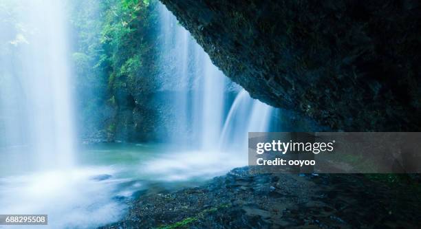 waterfalls behind the cliff - onsen japan stock pictures, royalty-free photos & images