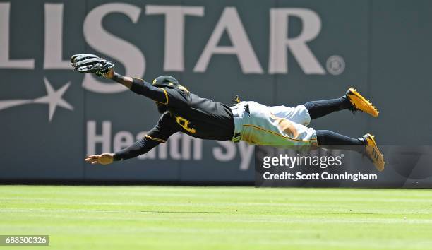 Josh Harrison of the Pittsburgh Pirates makes a diving catch during the third inning against the Atlanta Braves at SunTrust Park on May 25, 2017 in...