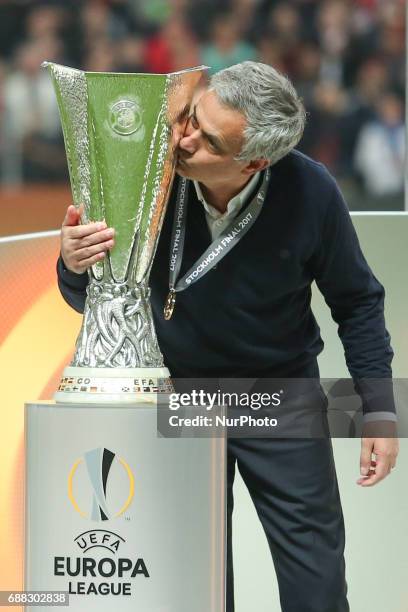 Manchester United's Portuguese manager Jose Mourinho kisses the trophy after the UEFA Europa League final football match Ajax Amsterdam v Manchester...