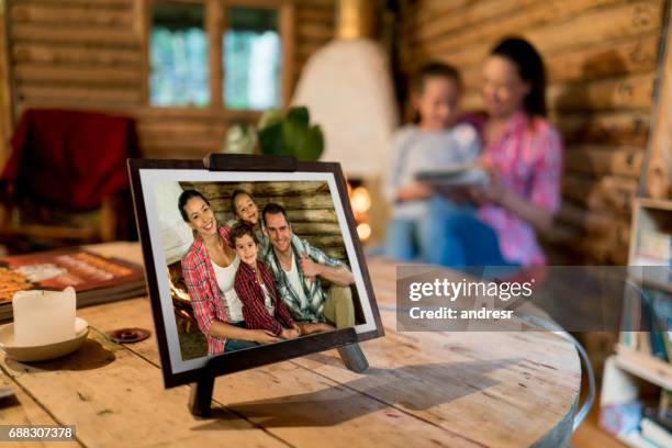 picture of a beautiful happy family on a frame at home - family photo stock pictures, royalty-free photos & images