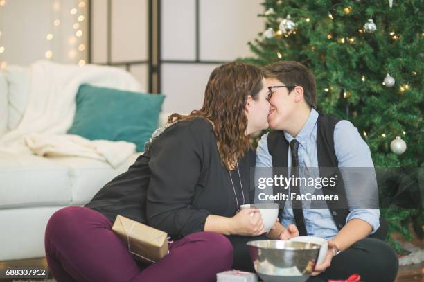 holiday couple - gay santa claus stock pictures, royalty-free photos & images