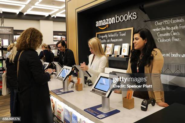 People shop in the newly opened Amazon Books on May 25, 2017 in New York City. Amazon.com Inc.'s first New York City bookstore occupies 4,000 square...