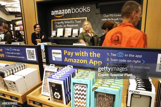 People shop in the newly opened Amazon Books on May 25, 2017 in New York City. Amazon.com Inc.'s first New York City bookstore occupies 4,000 square...