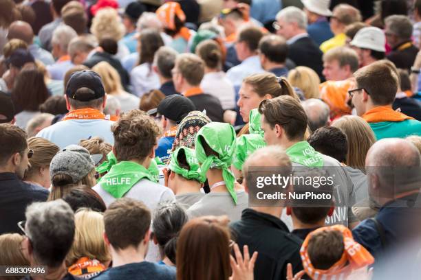 Participants of the Protestant Kirchentag awaits to attend the discussion between former US president Barack Obama and German Chancellor Angela...