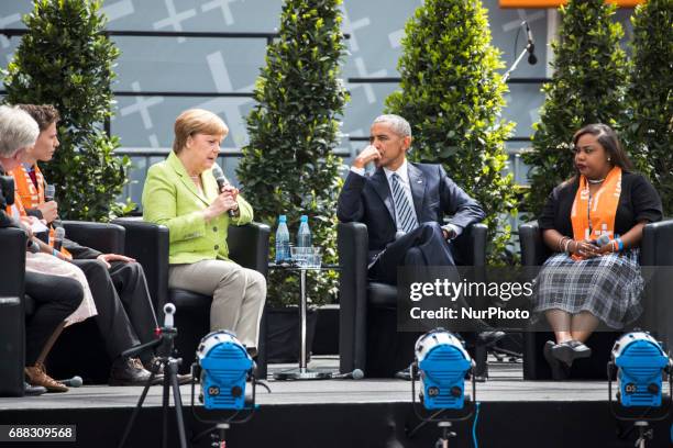 Former US President Barack Obama and German Chancellor Angela Merkel attend a panel discussion about democracy at the Protestant Kirchentag in...