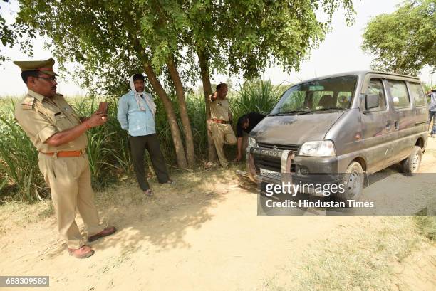 The car, in which the family was travelling, at the spot on the Jewar-Bulandshahr road off the Yamuna Expressway on May 25, 2017 in Greater Noida,...