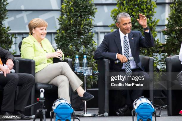 Former US President Barack Obama and German Chancellor Angela Merkel attend a panel discussion about democracy at the Protestant Kirchentag in...