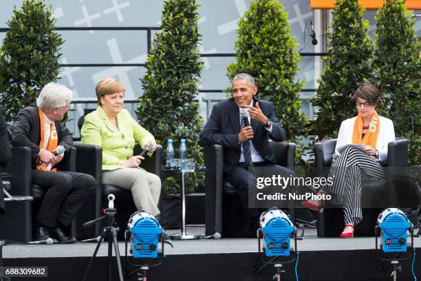 Former US President Barack Obama and German Chancellor Angela Merkel attend a panel discussion about democracy at the Protestant Kirchentag in...