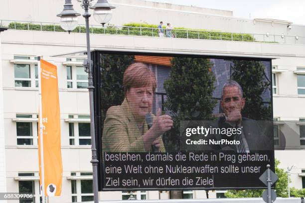 Monitor shows Former US President Barack Obama and German Chancellor Angela Merkel during a panel discussion about democracy at the Protestant...