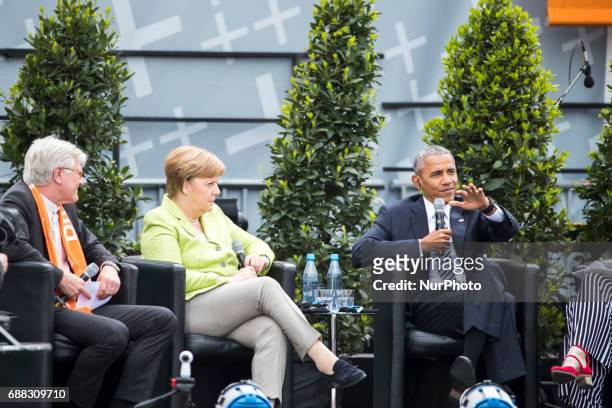 Former US President Barack Obama and German Chancellor Angela Merkel attend a panel discussion about democracy at the Protestant Kirchentag in...