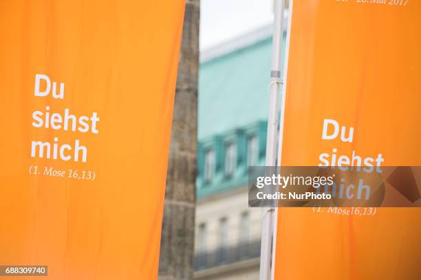 Banners of the Kirchentag reading 'you see me' are pictured in front of Brandenburg Gate in Berlin, Germany on May 25, 2017.