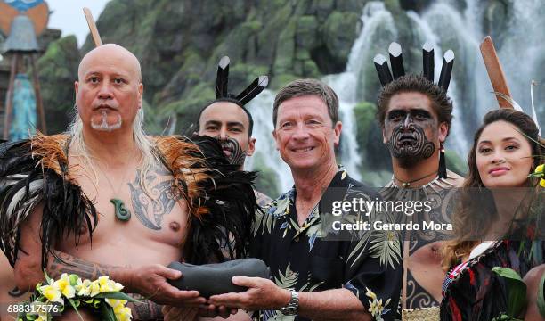 Bill Davis , President and COO, Universal Orlando Resort, poses with New Zealand Maori indigenous performers during the new Volcano Bay Water Theme...