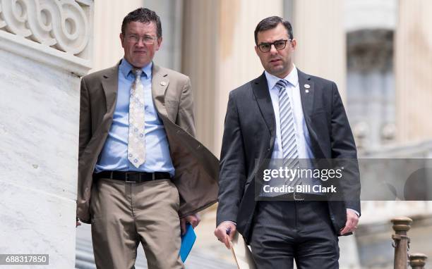 Rep. Thomas Massie, R-Ky., left, and Rep. Justin Amash, R-Mich., walk down the House steps as they leave the Capitol for the Memorial Day recess...