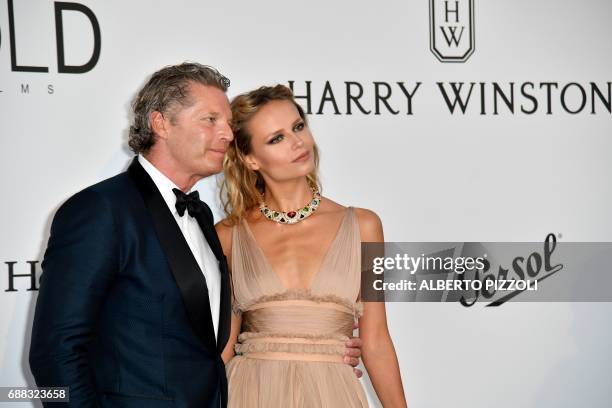 Dutch businessman Peter Bakker and Russian model Natasha Poly pose as they arrive for the amfAR's 24th Cinema Against AIDS Gala on May 25, 2017 at...