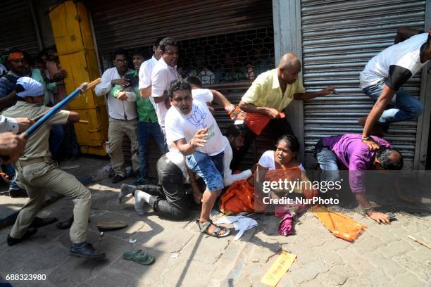 Indian police disperse the Bharatiya Janata Party activists during their march to the police headquarters in Kolkata, India on Thursday, 25th...