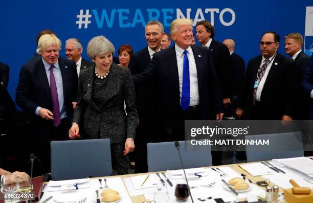 British Foreign Minister Boris Johnson, Prime Minister Theresa May, NATO Secretary General Jens Stoltenberg and US President Donald Trump look on...