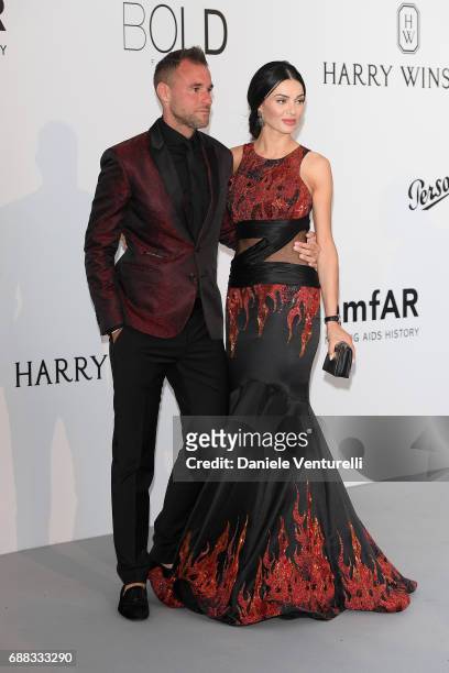 Philipp Plein and Andreea Sasu arrive at the amfAR Gala Cannes 2017 at Hotel du Cap-Eden-Roc on May 25, 2017 in Cap d'Antibes, France.