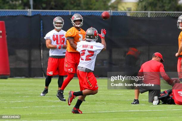 Jameis Winston makes a pass to runningback Doug Martin during the Tampa Bay Buccaneers OTA on May 23, 2017 at One Buccaneer Place in Tampa, Florida.
