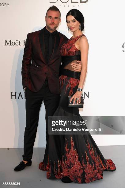 Philipp Plein and Andreea Sasu arrive at the amfAR Gala Cannes 2017 at Hotel du Cap-Eden-Roc on May 25, 2017 in Cap d'Antibes, France.