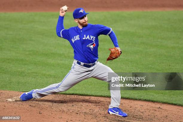 Danny Barnes of the Toronto Blue Jays pitches during a baseball game against the Baltimore Orioles at Oriole Park at Camden Yards on May 20, 2017 in...