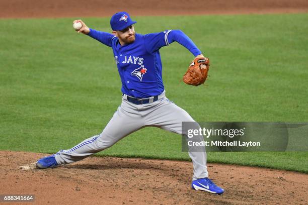 Danny Barnes of the Toronto Blue Jays pitches during a baseball game against the Baltimore Orioles at Oriole Park at Camden Yards on May 20, 2017 in...