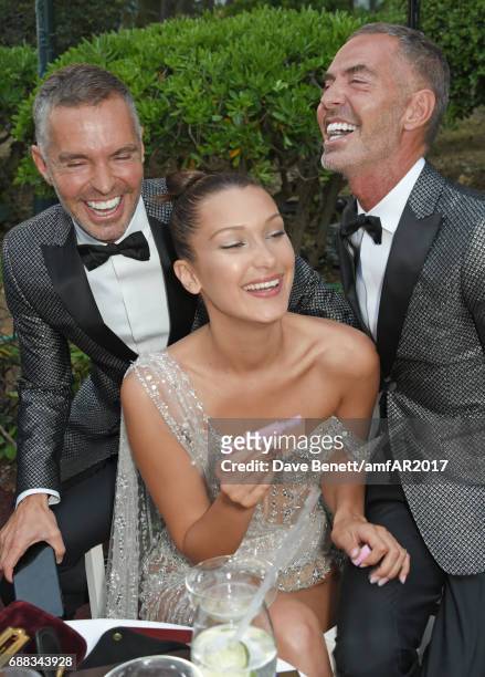 Dan Caten, Bella Hadid and Dean Caten attend the amfAR Gala Cannes 2017 at Hotel du Cap-Eden-Roc on May 25, 2017 in Cap d'Antibes, France.