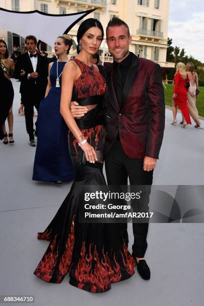 Philipp Plein and Andreea Sasu arrive at the amfAR Gala Cannes 2017 at Hotel du Cap-Eden-Roc on May 25, 2017 in Cap d'Antibes, France.