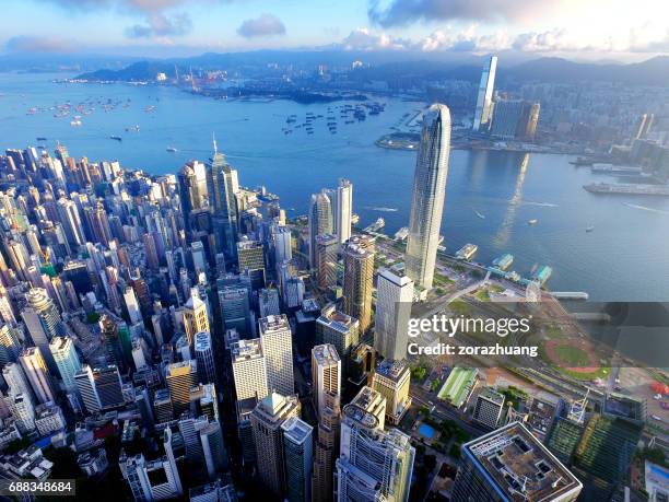 aerial view of hong kong city and victoria harbour - hong kong central stock pictures, royalty-free photos & images