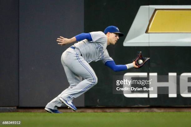 Chris Coghlan of the Toronto Blue Jays catches a fly ball in the second inning against the Milwaukee Brewers at Miller Park on May 24, 2017 in...