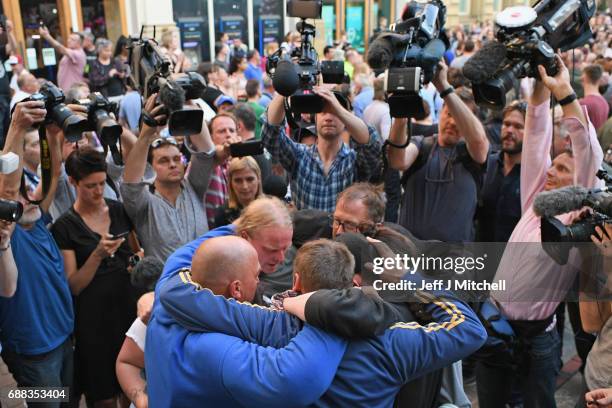 Paul Hodgson , partner of Charlotte Campbell, whose daughter Olivia died in Monday's terror attack at the Manchester Arena attack, hugs friends on...