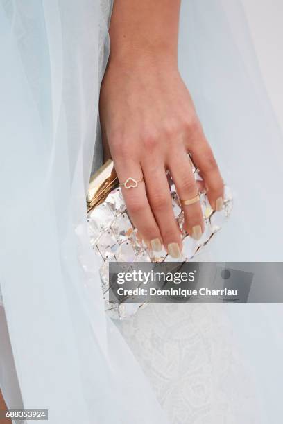 Silja Litvin, clutch and jewelry detail, arrives at the amfAR Gala Cannes 2017 at Hotel du Cap-Eden-Roc on May 25, 2017 in Cap d'Antibes, France.