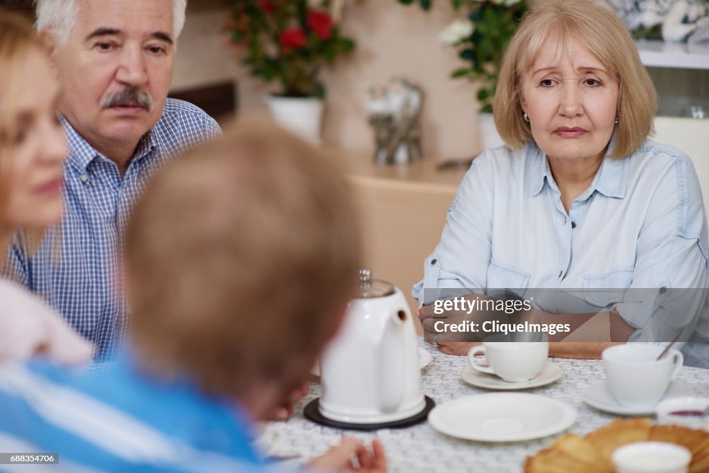 Family drinking tea at brunch