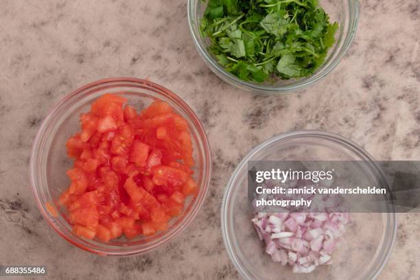 tomato concasse, chopped shallot and chopped parsley. - shallot stock pictures, royalty-free photos & images