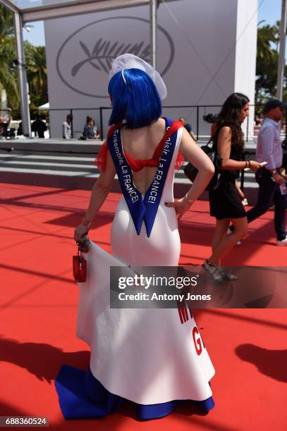 Guest wears a "Make France Great Again" dress attends the "A Gentle Creature " screening during the 70th annual Cannes Film Festival at Palais des...
