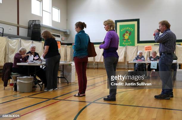Voters wait in line to register h in a polling station at Hellgate Elementary School on May 25, 2017 in Missoula, Montana. Montanans are heading to...
