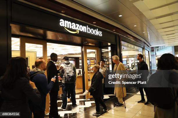 People enter the newly opened Amazon Books on May 25, 2017 in New York City. Amazon.com Inc.'s first New York City bookstore occupies 4,000 square...