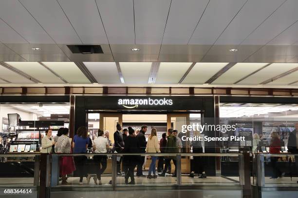 People enter the newly opened Amazon Books on May 25, 2017 in New York City. Amazon.com Inc.'s first New York City bookstore occupies 4,000 square...