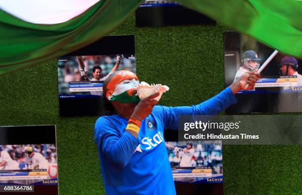 Sachin's' fan waves Indian flag during during the screening of 'Sachin: A Billion Dreams' film at PVR on May 24, 2017 in Mumbai, India. British...