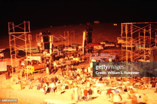 Stage and sound towers are constructed before crowds arrive at the Altamont Speedway for the free concert headlined by the Rolling Stones.