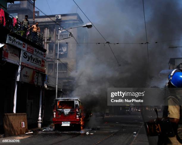 Bharatiya Janata Party activists set fire on police jeep during their march to the police headquarters in Kolkata, India on Thursday, 25th May,2017....