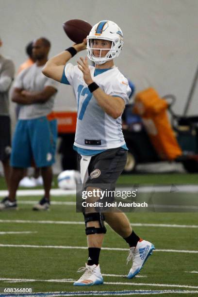 Ryan Tannehill of the Miami Dolphins throws the ball during the teams OTA's on May 25, 2017 at the Miami Dolphins training facility in Davie, Florida.