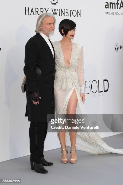 Hermann Buehlbecker and Paz Vega arrive at the amfAR Gala Cannes 2017 at Hotel du Cap-Eden-Roc on May 25, 2017 in Cap d'Antibes, France.