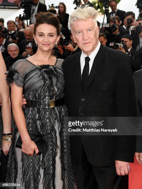 Emily Stofle and David Lynch attend the "Twin Peaks" screening during the 70th annual Cannes Film Festival at Palais des Festivals on May 25, 2017 in...