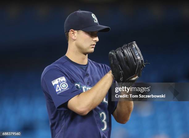 Chase De Jong of the Seattle Mariners looks in before delivering a pitch in the first inning during MLB game action against the Toronto Blue Jays at...