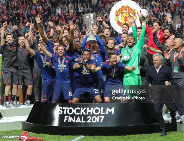 Wayne Rooney of Manchester United lifts the trophy following the UEFA Europa League Final match between Ajax and Manchester United at Friends Arena...