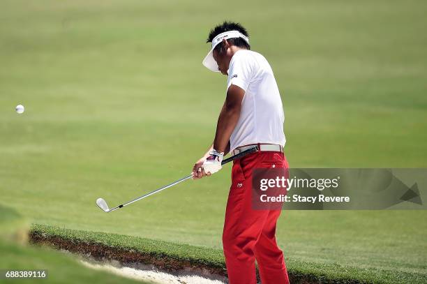 Yuta Ikeda of Japan plays a shot from a bunker on the 11th hole during Round One of the DEAN & DELUCA Invitational at Colonial Country Club on May...