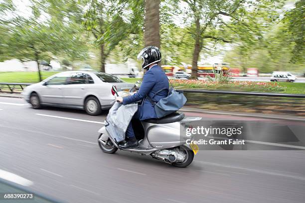 commuter. - motor scooter stock pictures, royalty-free photos & images
